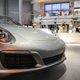 Illustration for article titled This Couple Topped Your Wildest Dreams By Getting Married In A Porsche Showroom